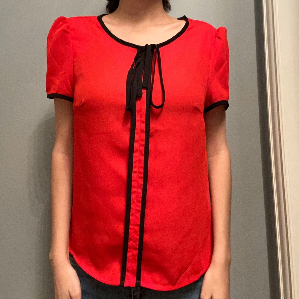 Red shirt with ribbon/bow with mark